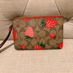Coach Tan Wristlet with Red Strawberry Design